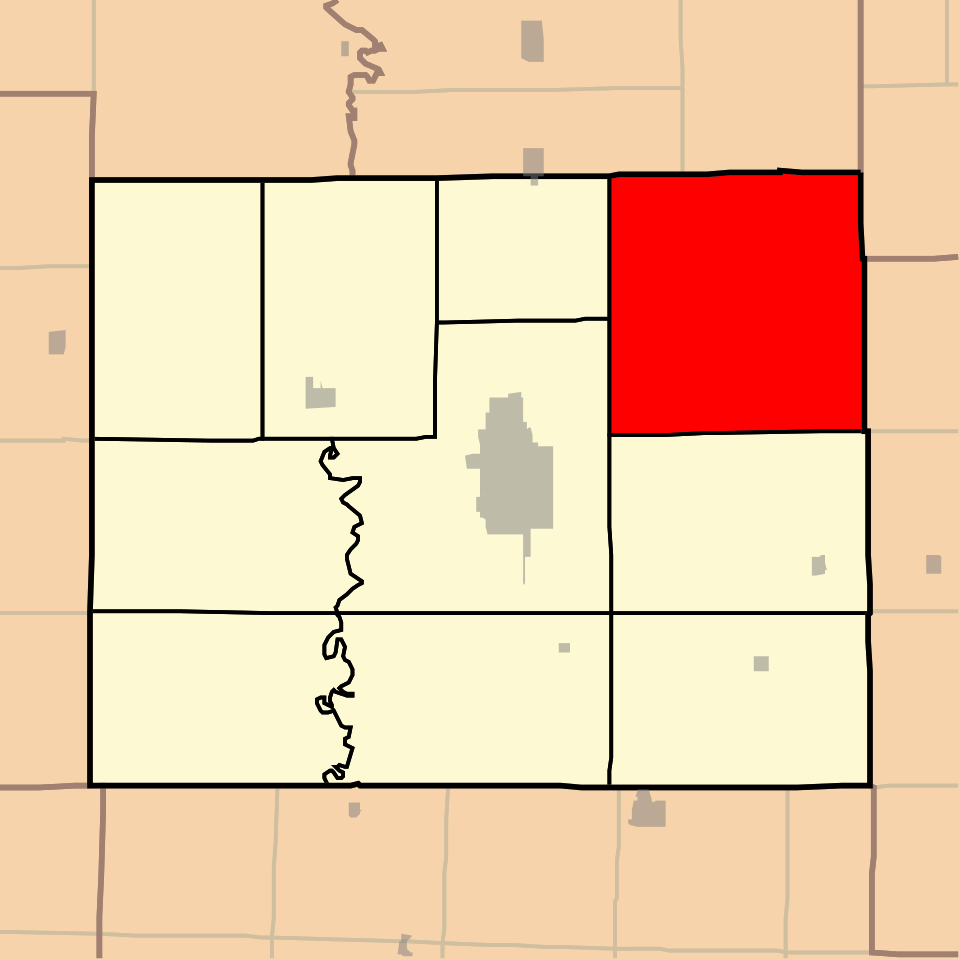 Photograph of Adair county map with Clay township highlighted in red in the top right.
