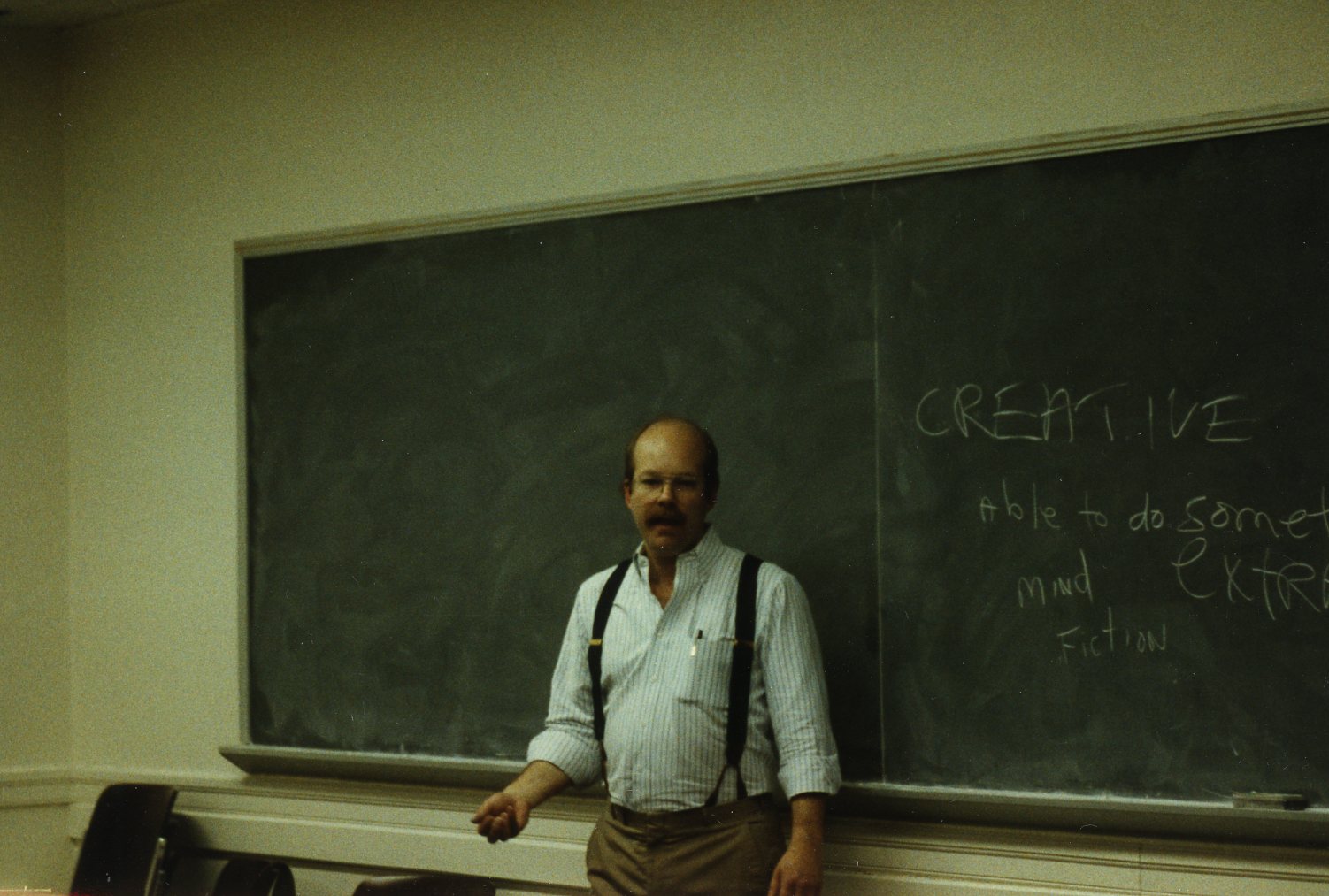 Dan Hunter standing in front of a chalkboard