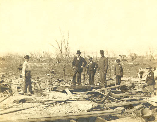 men standing amidst wreckage