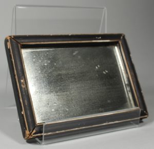 This framed shaving mirror (HF.1.69) enlarged your face so you could see where you were shaving more closely.
